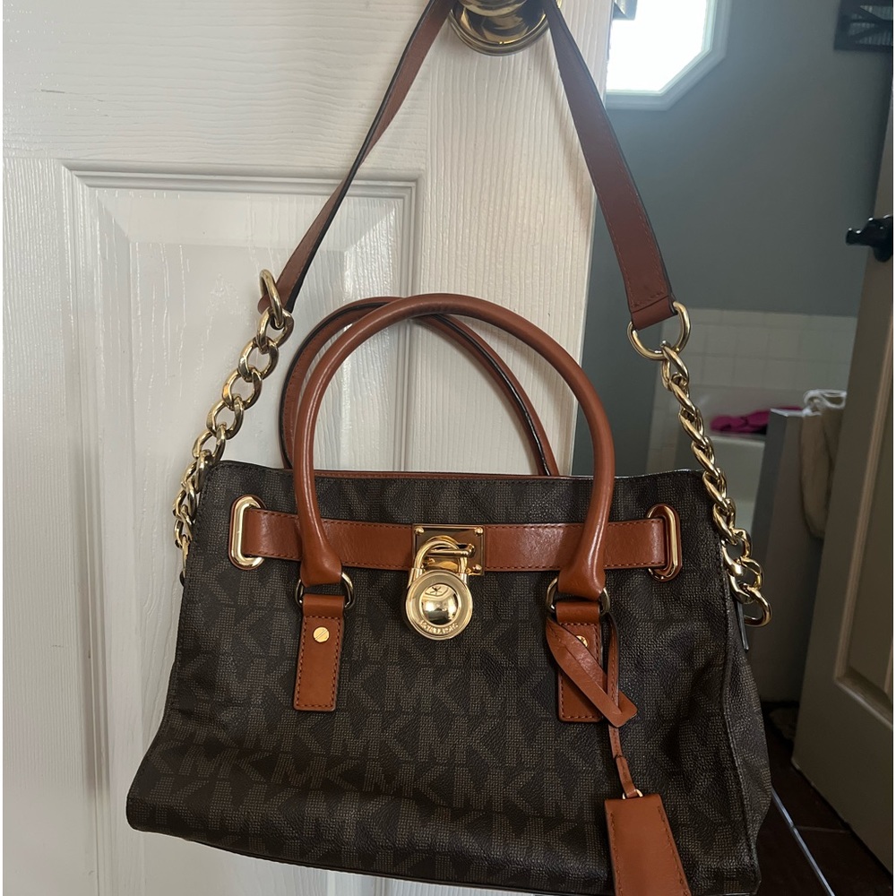 Authentic Michael Kors purse . Almost perfect condition .